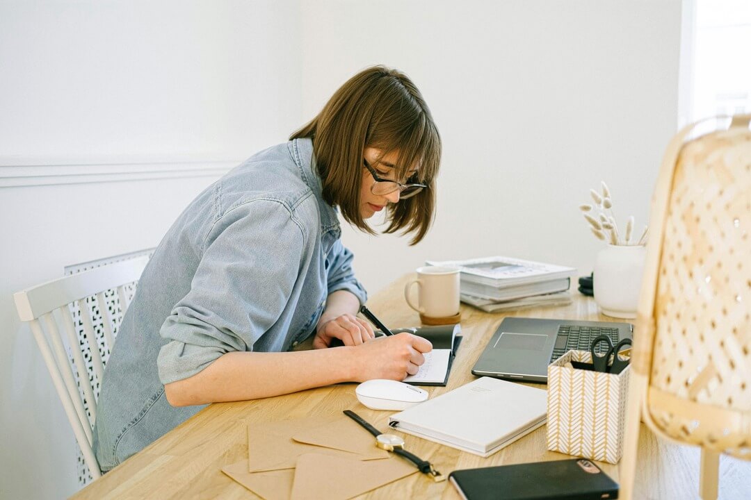 Freelancer working from home at desk with laptop